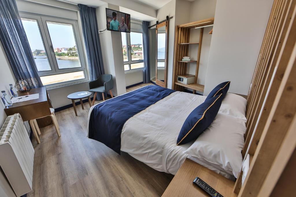 Cama o camas de una habitación en Playa de Camariñas