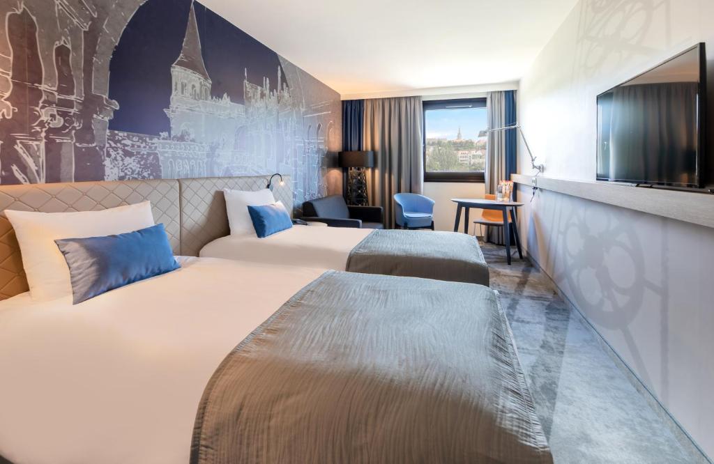 Posteľ alebo postele v izbe v ubytovaní Mercure Budapest Castle Hill