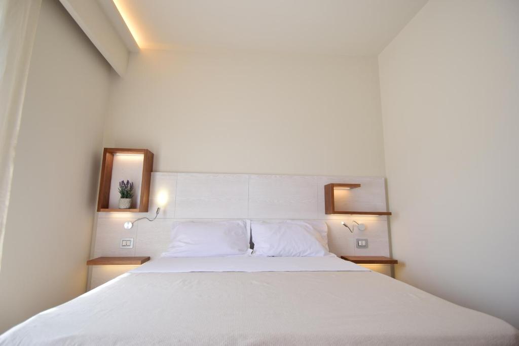 Postel nebo postele na pokoji v ubytování B&B Maestrale