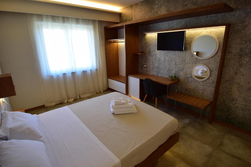 Postel nebo postele na pokoji v ubytování B&B Maestrale