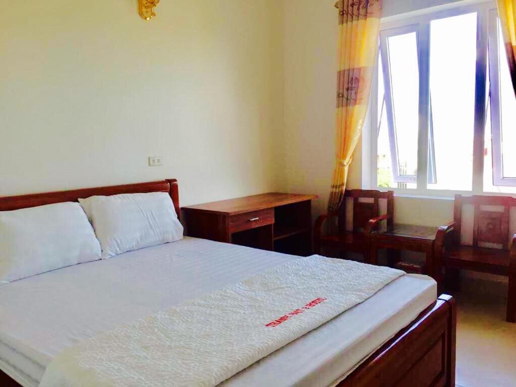 Postel nebo postele na pokoji v ubytování Thanh Dat 2 Hotel