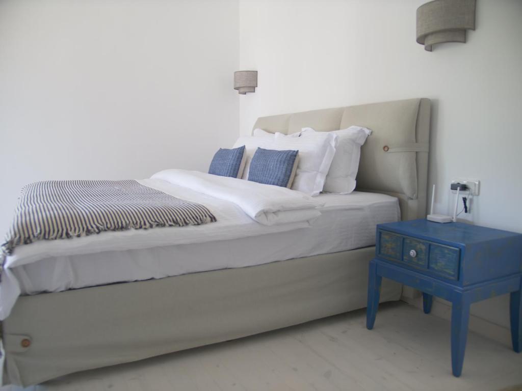 A bed or beds in a room at Villa Roxy 3 BR villa with one of the most unique gardens in Kalkan