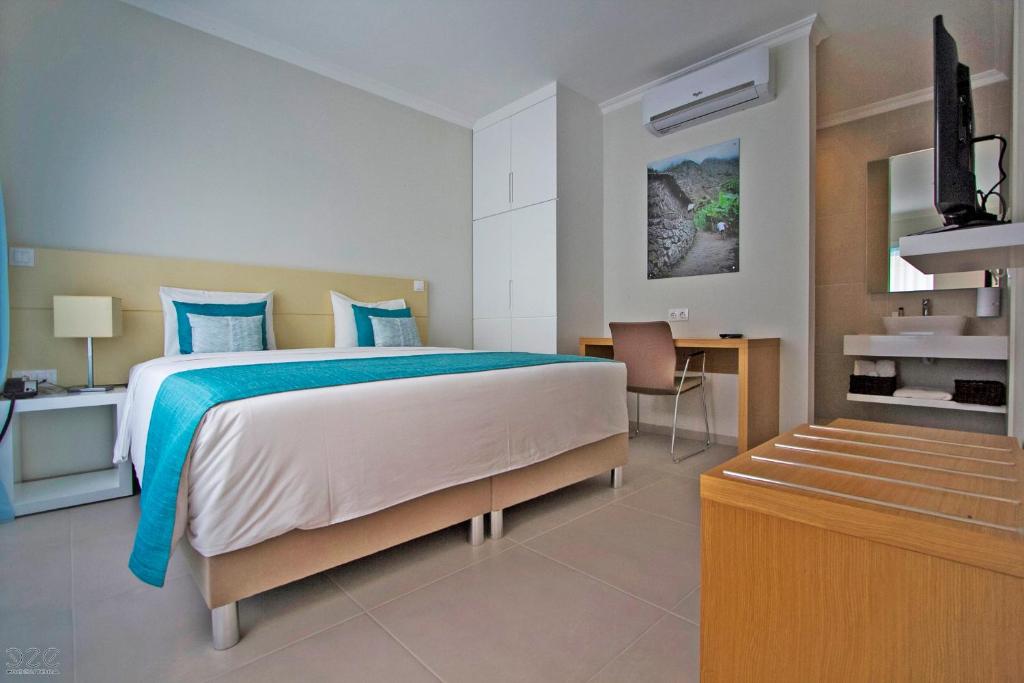 Postel nebo postele na pokoji v ubytování Tiduca Hotel