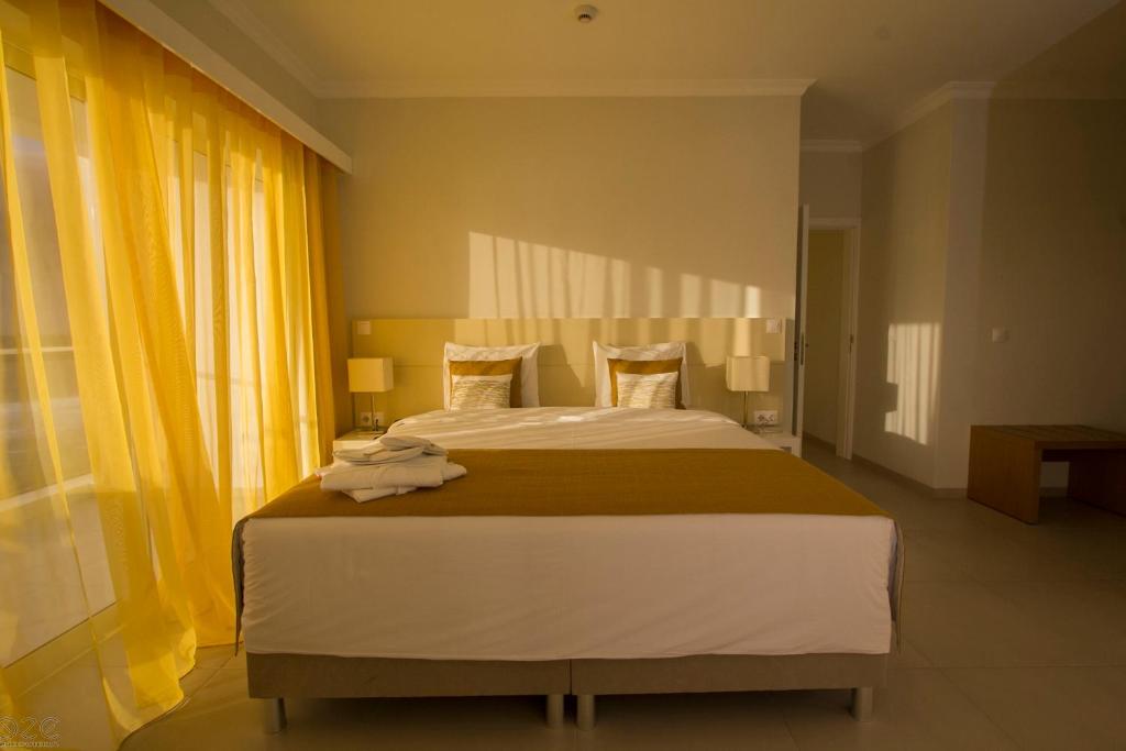 Postel nebo postele na pokoji v ubytování Tiduca Hotel