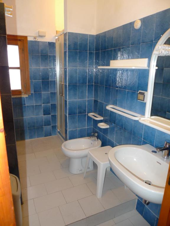 Koupelna v ubytování Hotel Alexander