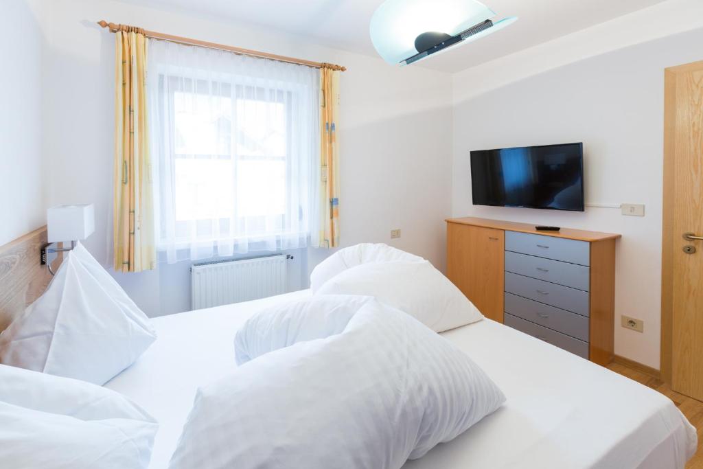 Postel nebo postele na pokoji v ubytování Hotel Seppi