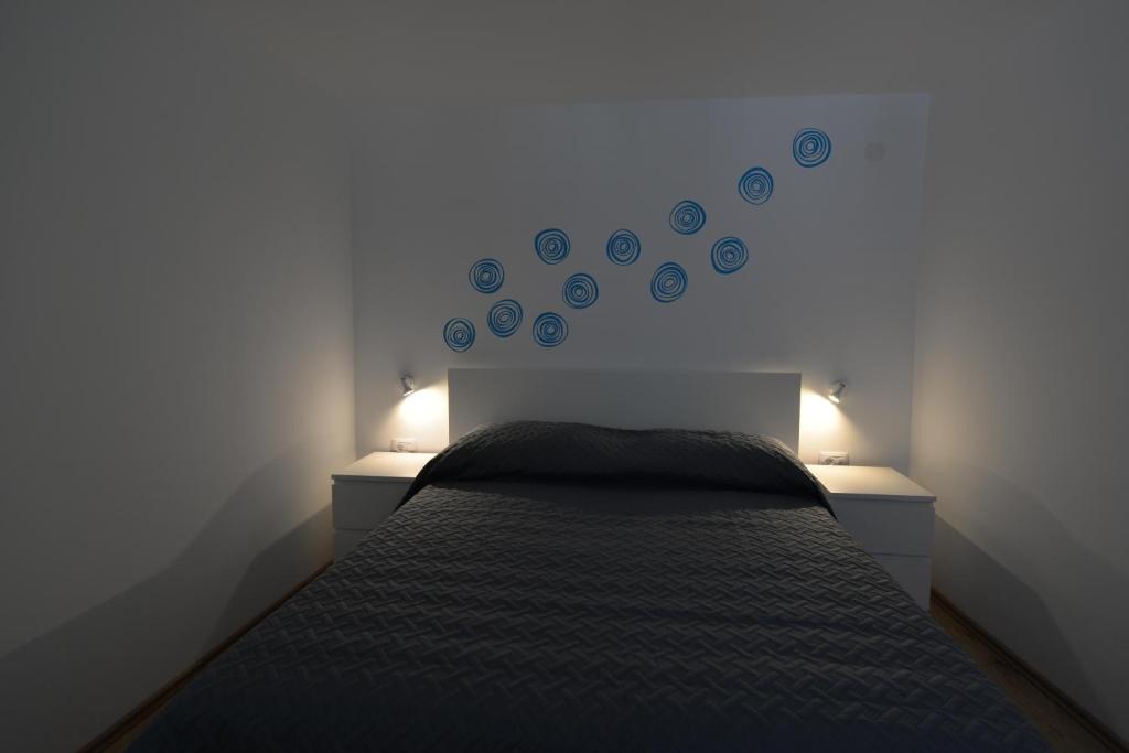 Postel nebo postele na pokoji v ubytování Apartments and Rooms Oliva