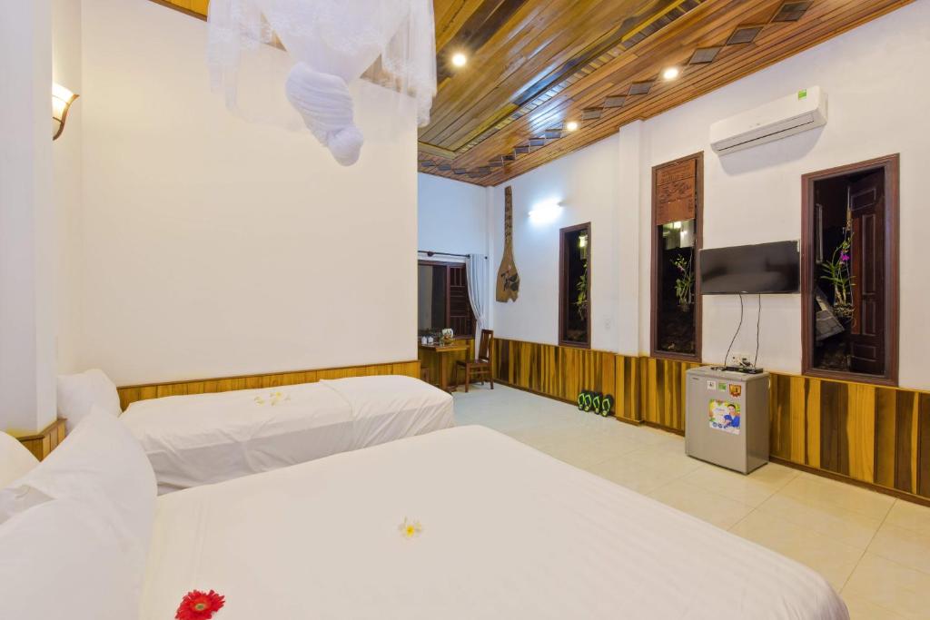 Postel nebo postele na pokoji v ubytování Seaside An Bang Homestay