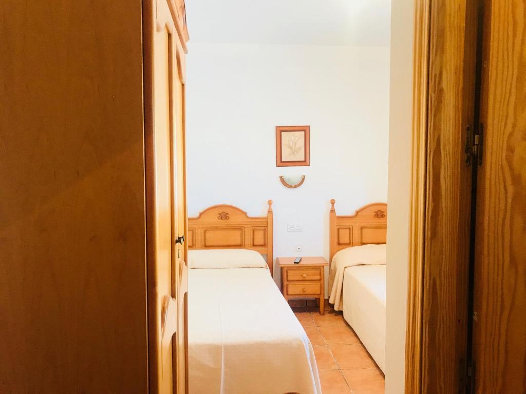 Cama o camas de una habitación en Hostal Restaurante Ecuador