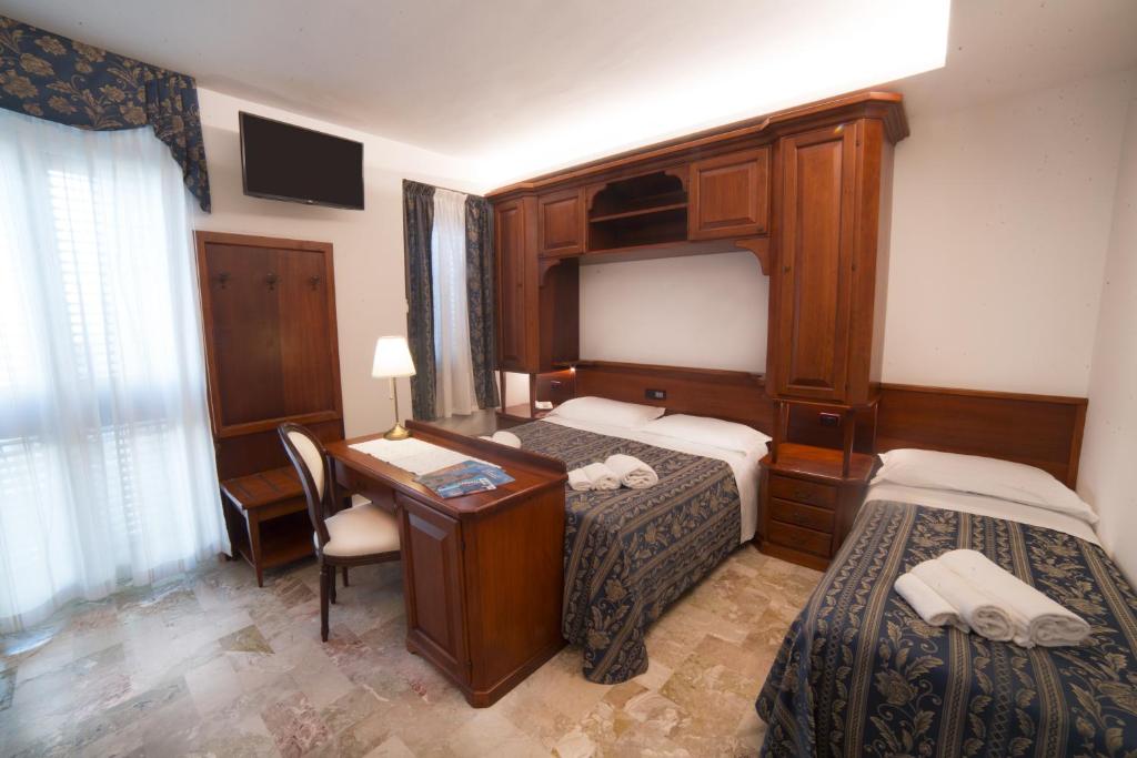 Łóżko lub łóżka w pokoju w obiekcie Hotel La Giara