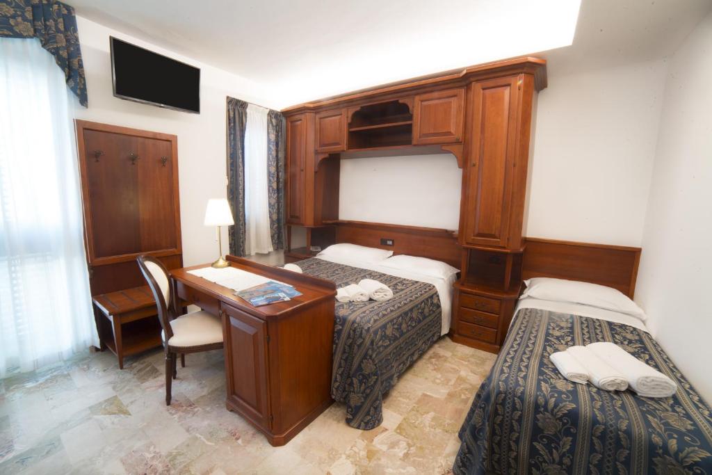 Łóżko lub łóżka w pokoju w obiekcie Hotel La Giara