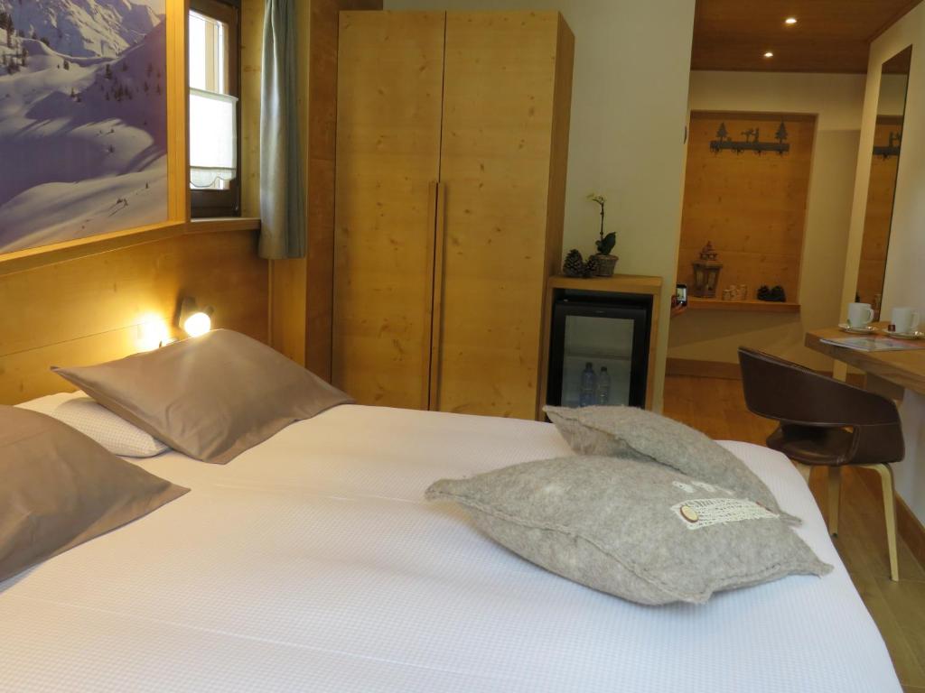 Postel nebo postele na pokoji v ubytování Hotel Compagnoni