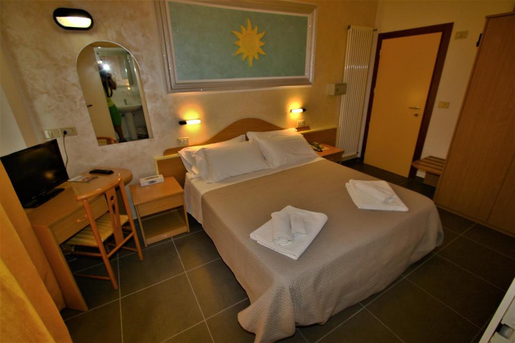 Postel nebo postele na pokoji v ubytování Hotel De Amicis