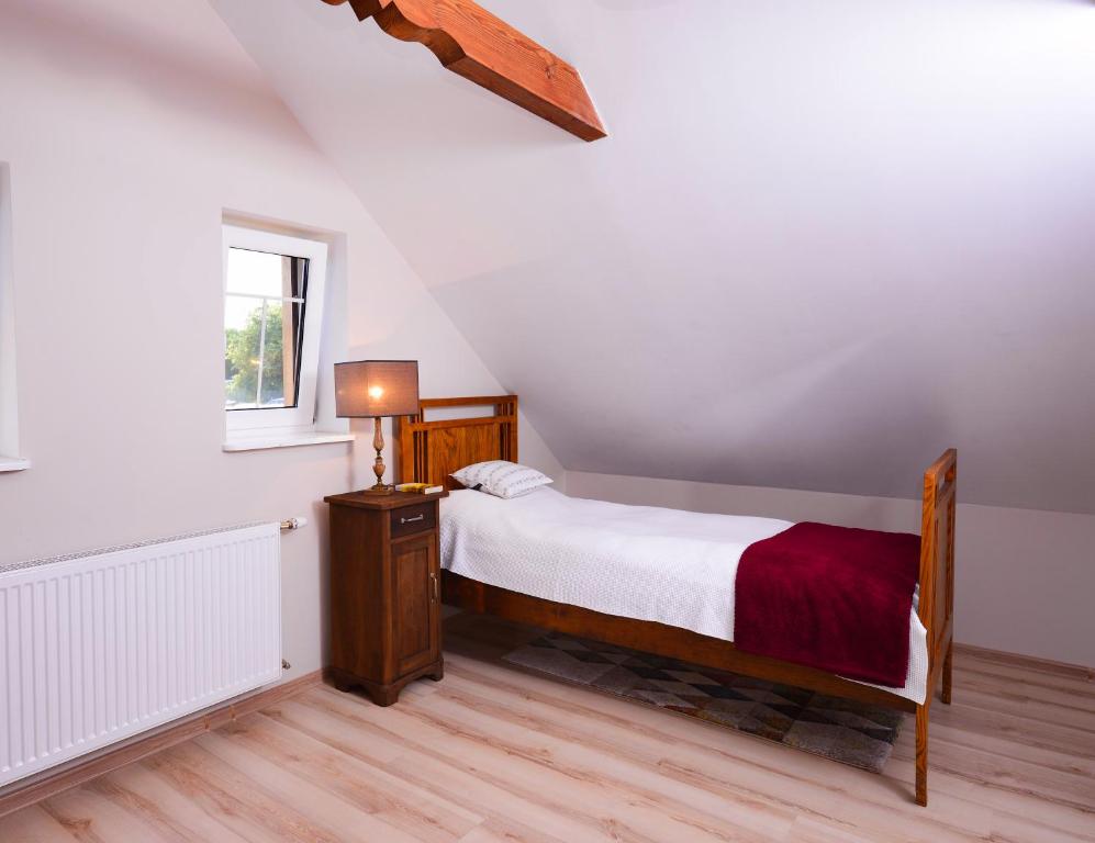 Posteľ alebo postele v izbe v ubytovaní Apartament Topczewo