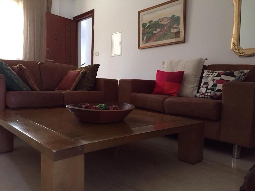 a living room with a couch and a coffee table at Villa Maria in Tunis