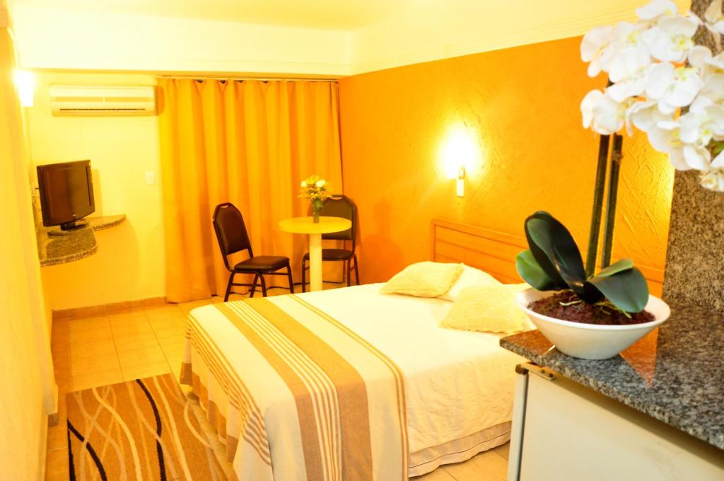 Cama ou camas em um quarto em Natal Praia Hotel