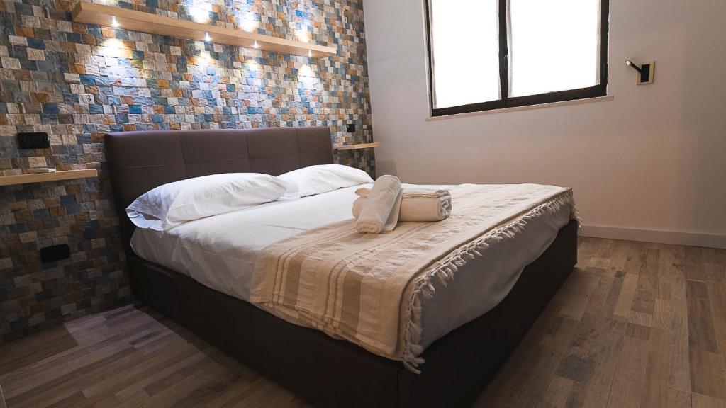 Postel nebo postele na pokoji v ubytování La Casetta