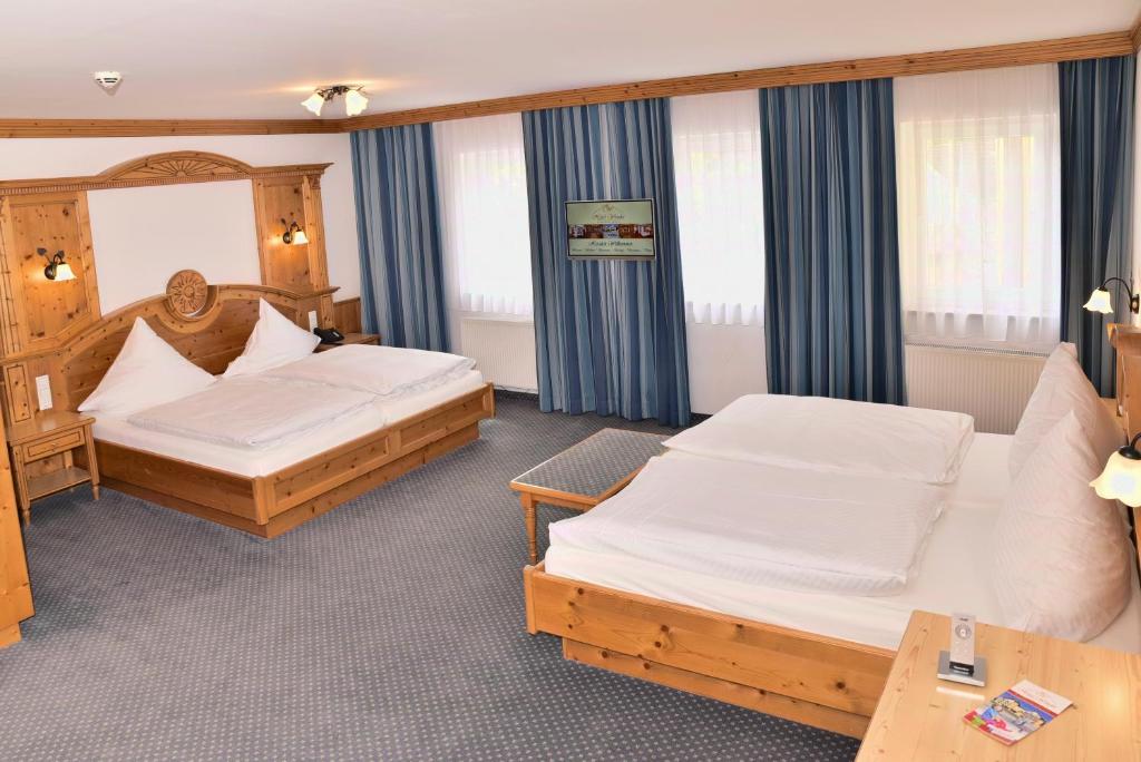 Postel nebo postele na pokoji v ubytování Hotel Wender