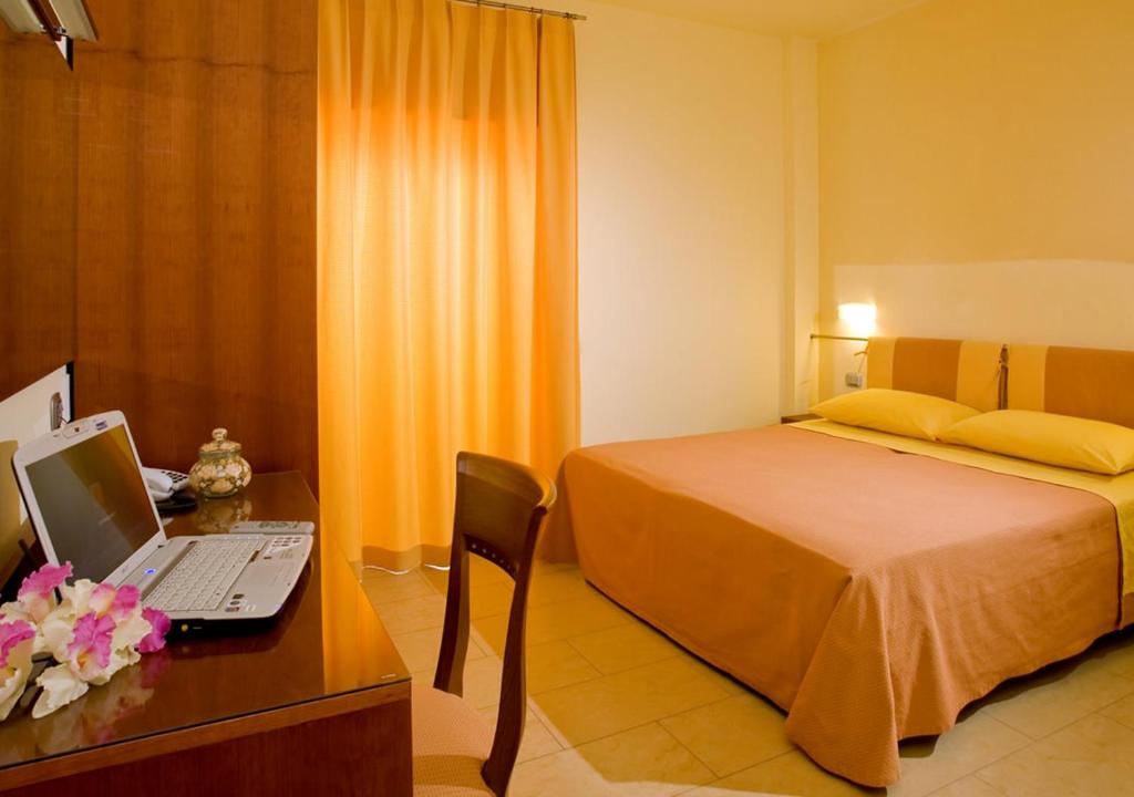Postel nebo postele na pokoji v ubytování Hotel Palace Magnolia SPA