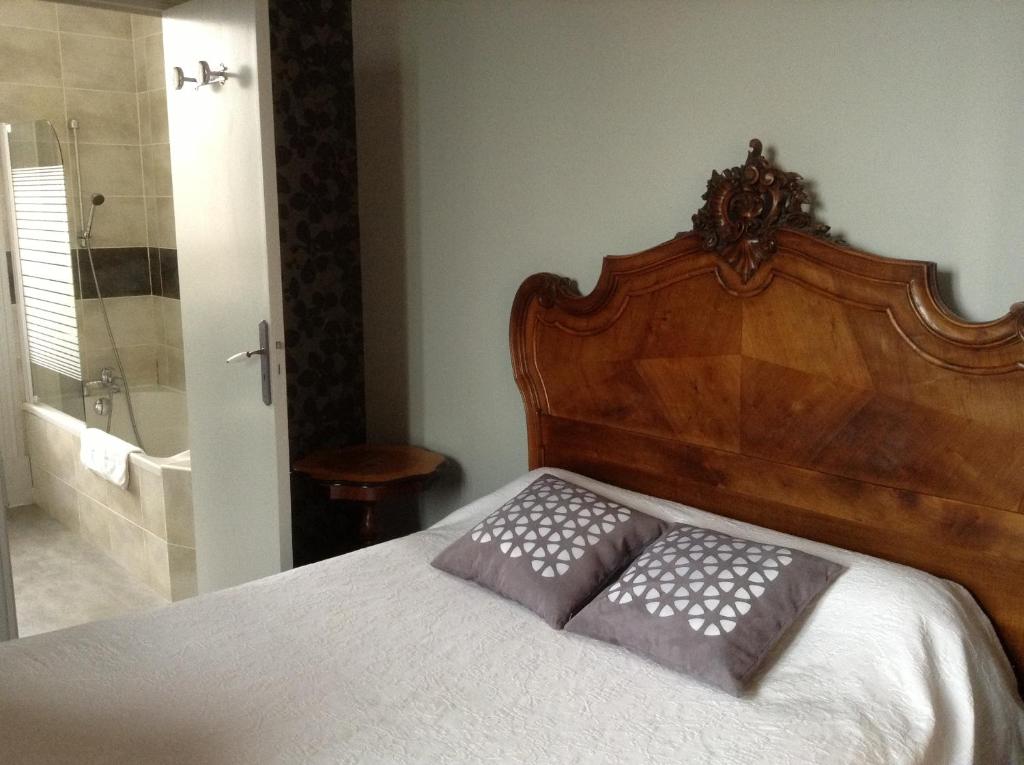 Postel nebo postele na pokoji v ubytování L'Hôtel L'Astrée