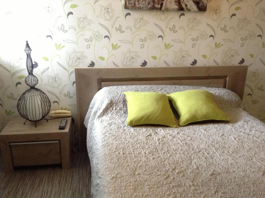 Postel nebo postele na pokoji v ubytování L'Hôtel L'Astrée