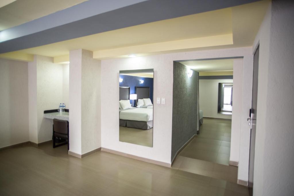 Postel nebo postele na pokoji v ubytování Hotel Ha