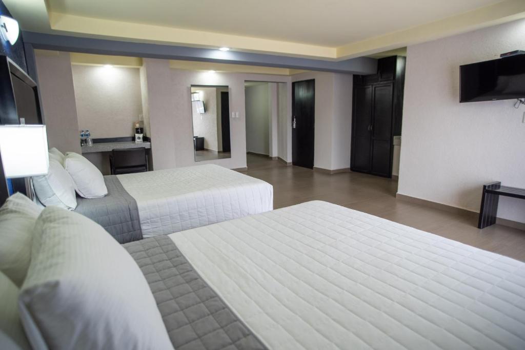 Postel nebo postele na pokoji v ubytování Hotel Ha