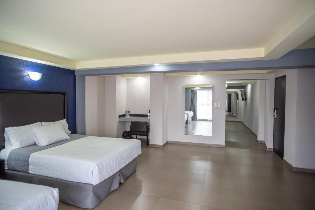 Postel nebo postele na pokoji v ubytování Hotel Ha