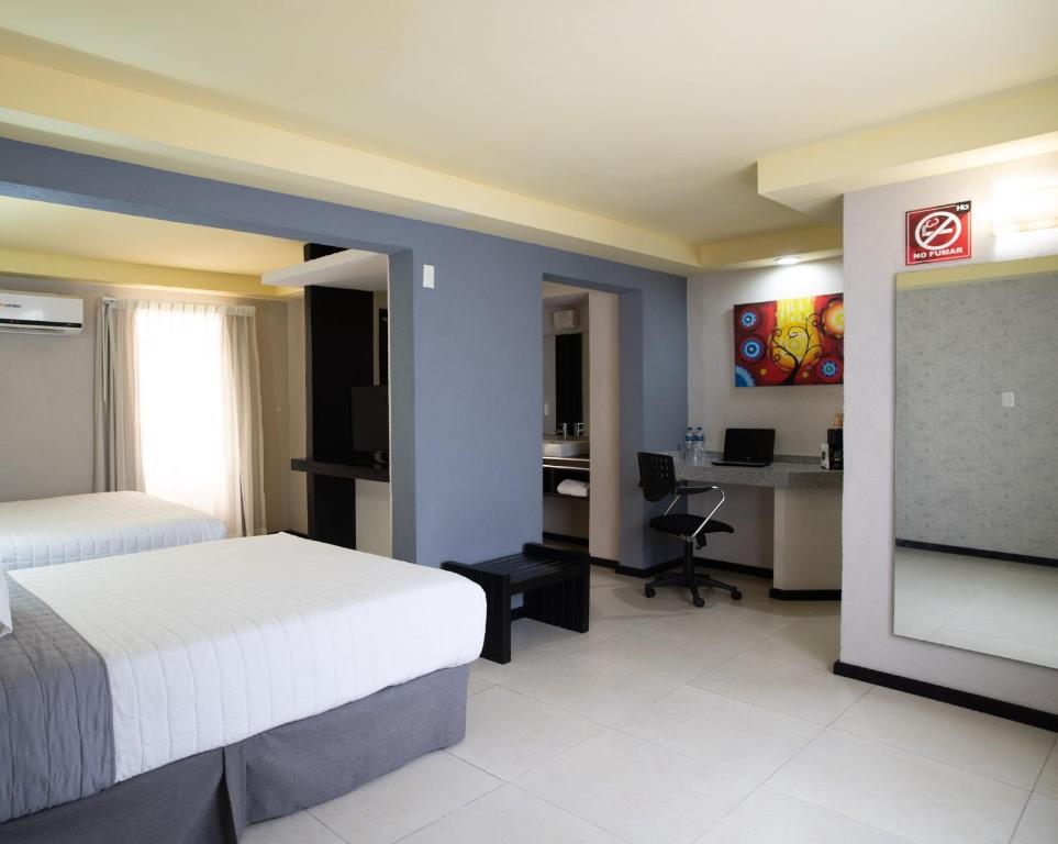 Postel nebo postele na pokoji v ubytování Hotel Ha
