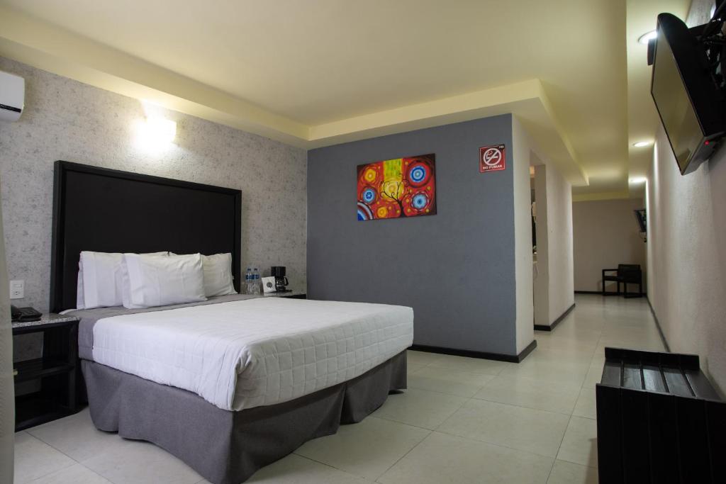 Postel nebo postele na pokoji v ubytování Hotel Ha