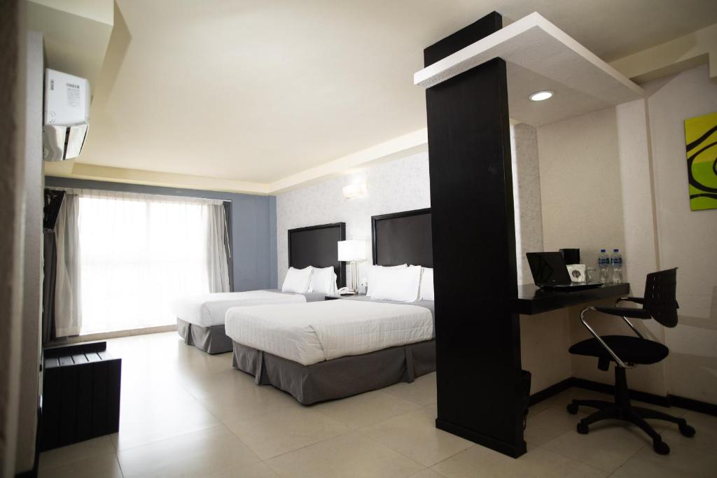 Postel nebo postele na pokoji v ubytování Hotel Ha