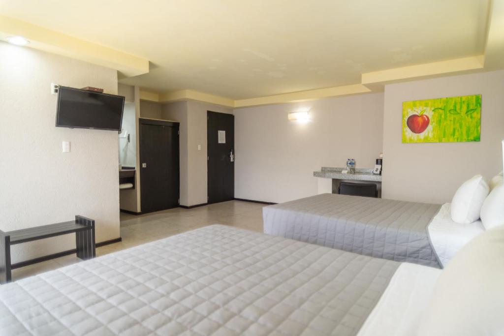 Postel nebo postele na pokoji v ubytování Hotel Ha