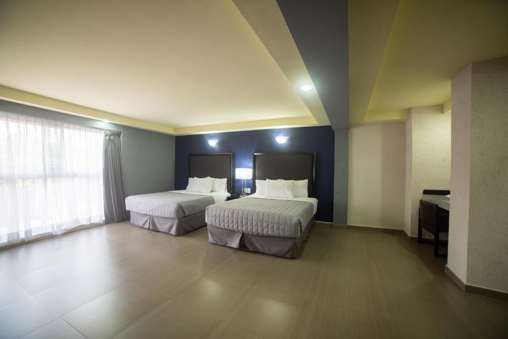 Postel nebo postele na pokoji v ubytování Hotel Ha