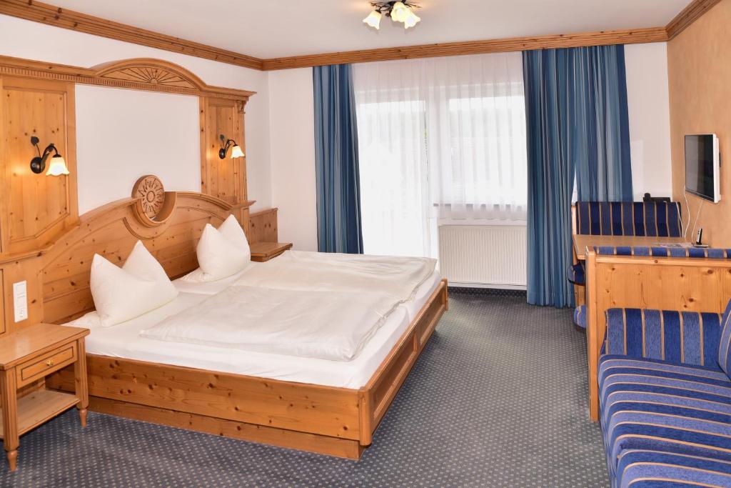 Postel nebo postele na pokoji v ubytování Hotel Wender