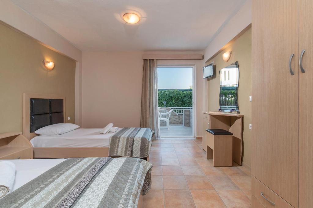 Postel nebo postele na pokoji v ubytování House Meltemi