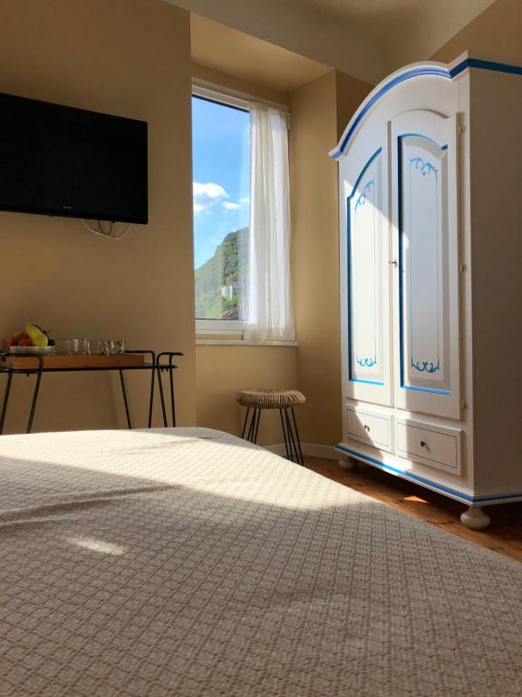 TV in/ali zabaviščno središče v nastanitvi Orto al Mare Room Rental
