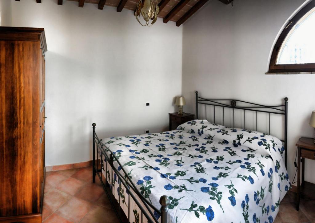 Postel nebo postele na pokoji v ubytování Agriturismo Le Case