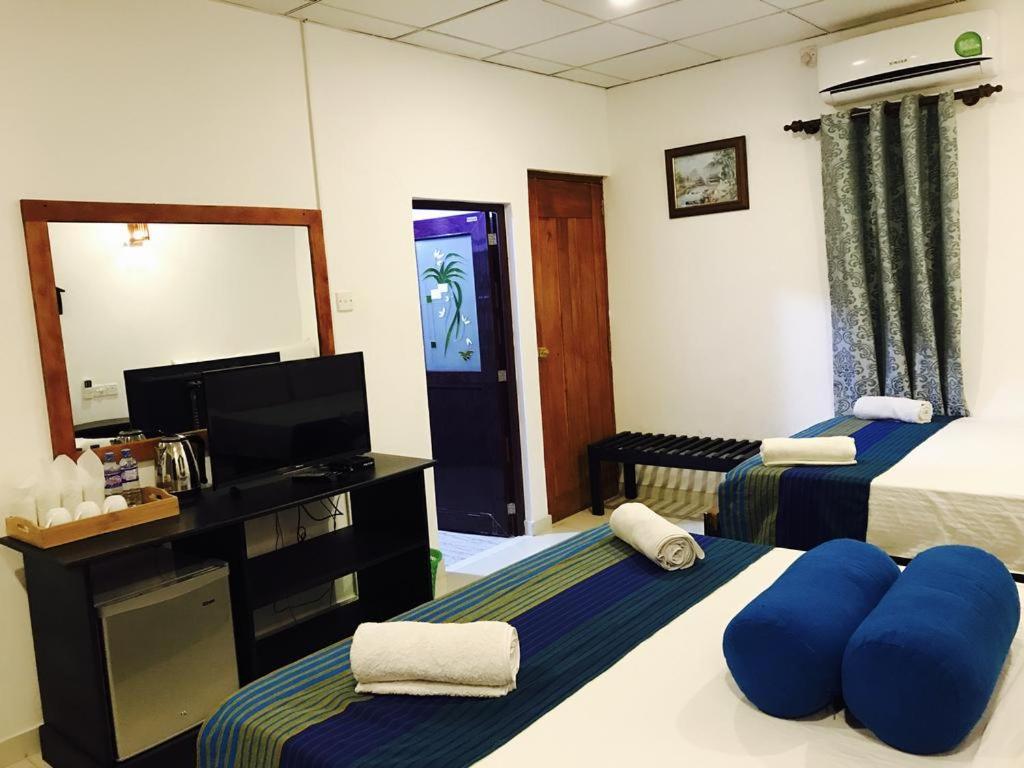Postel nebo postele na pokoji v ubytování Sunshine Resort & Spa Sigiriya