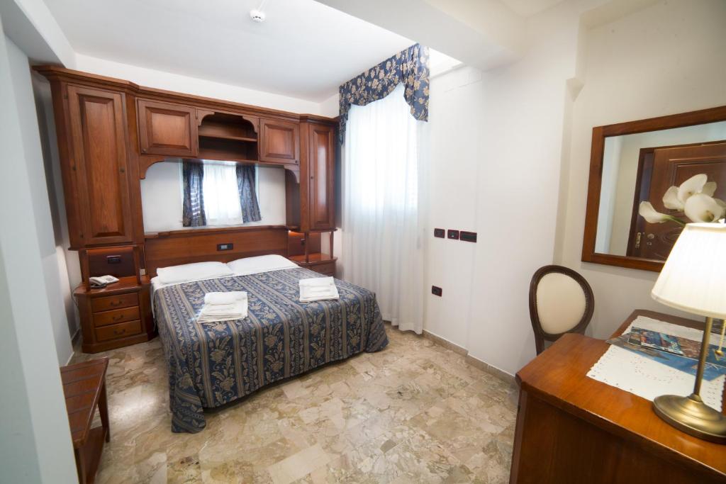 Łóżko lub łóżka w pokoju w obiekcie Hotel La Giara