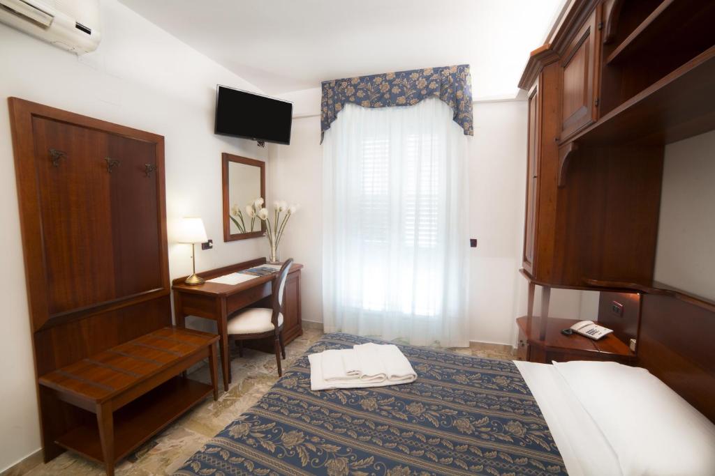 Łóżko lub łóżka w pokoju w obiekcie Hotel La Giara
