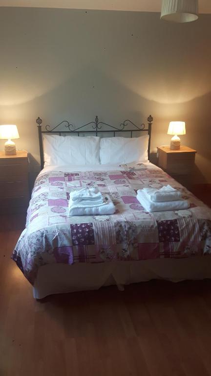 Postel nebo postele na pokoji v ubytování Nellies Cottage B&B