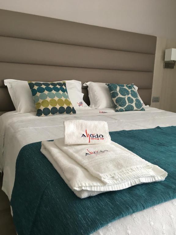 Postel nebo postele na pokoji v ubytování Alludo Aparthotel b&b
