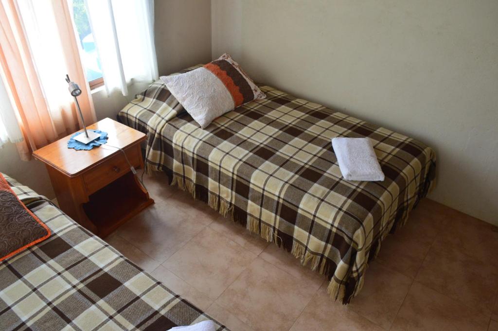 Postel nebo postele na pokoji v ubytování Casa de Lelia