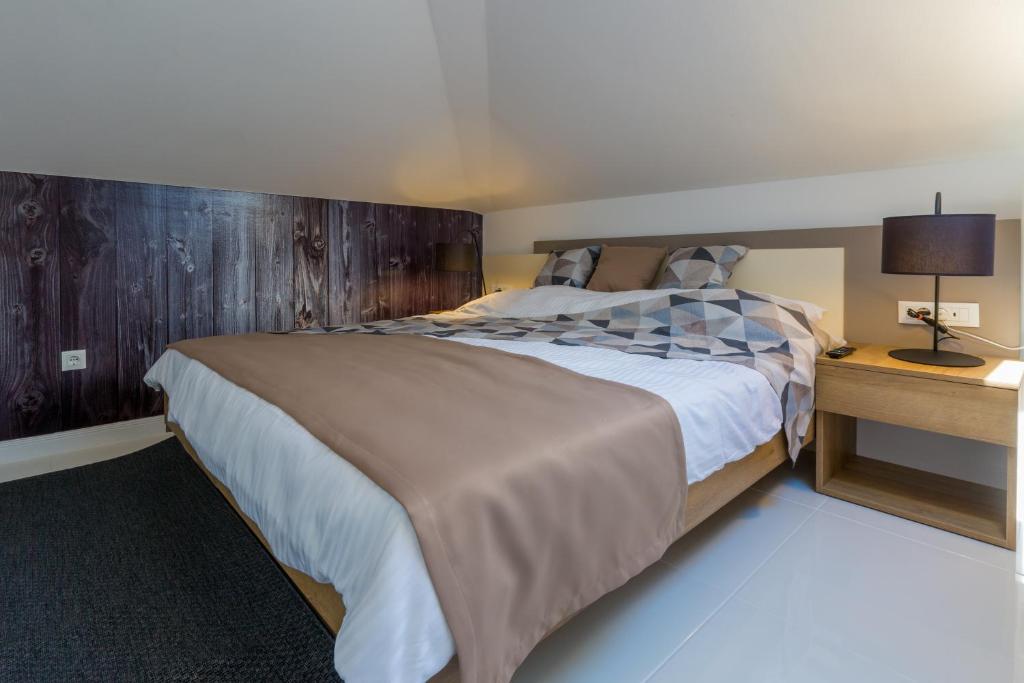 Postel nebo postele na pokoji v ubytování Boutique Apartments "7 Angels"