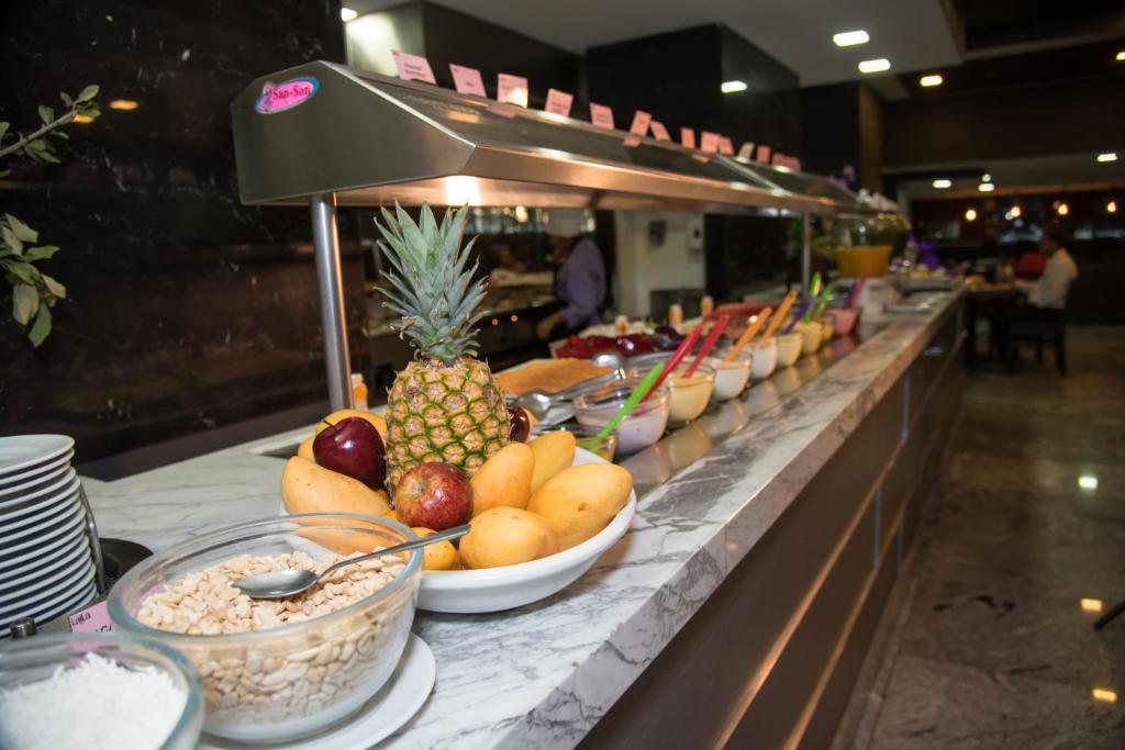A close view along a fruit, cereal and cold-breakfast buffet.