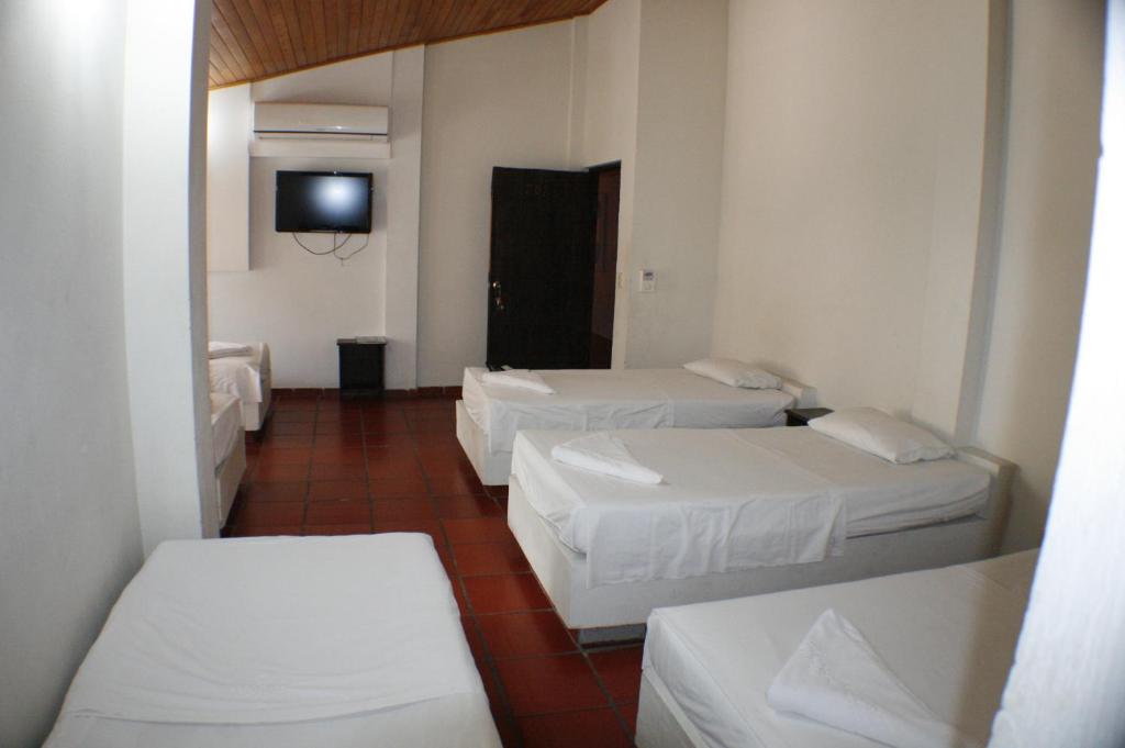 Postel nebo postele na pokoji v ubytování Hotel y Parque Acuatico Agua Sol Alegria