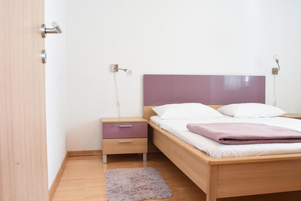 Postel nebo postele na pokoji v ubytování Apartments Lila