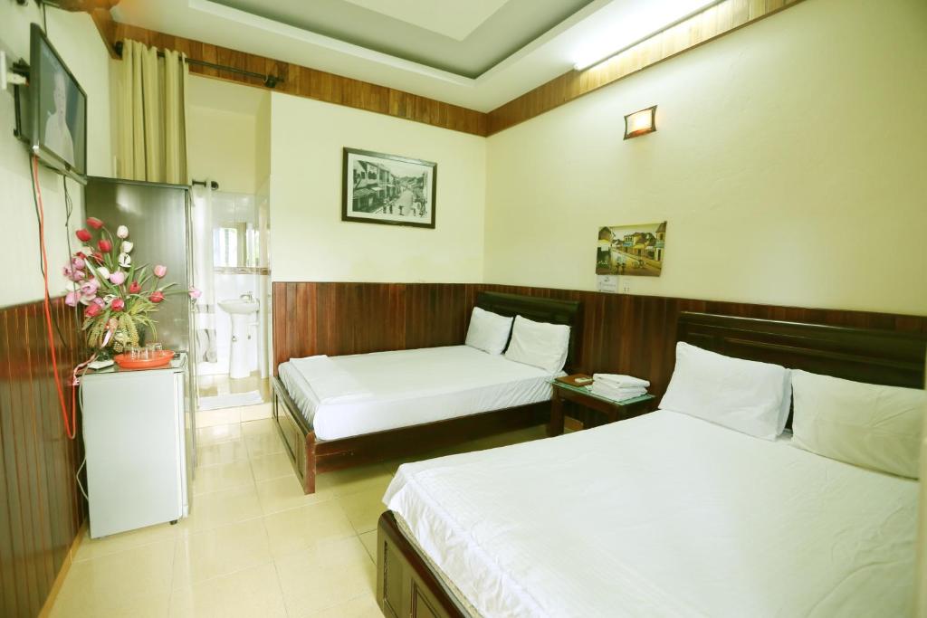 Postel nebo postele na pokoji v ubytování Homestay Hong Cong