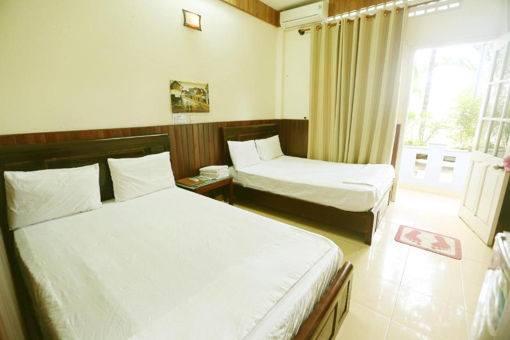 Postel nebo postele na pokoji v ubytování Homestay Hong Cong