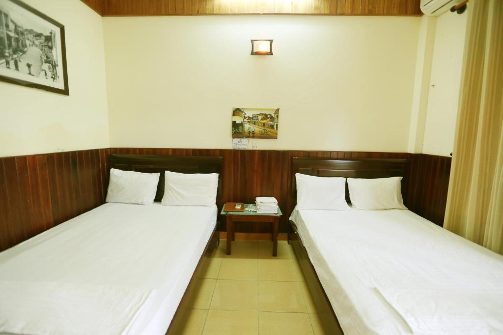 Postel nebo postele na pokoji v ubytování Homestay Hong Cong